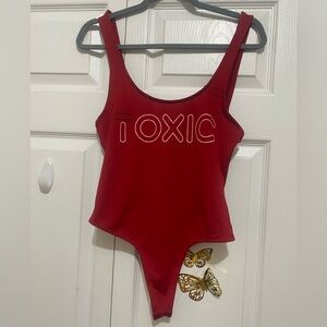 Red bodysuit with front “TOXIC” print for women